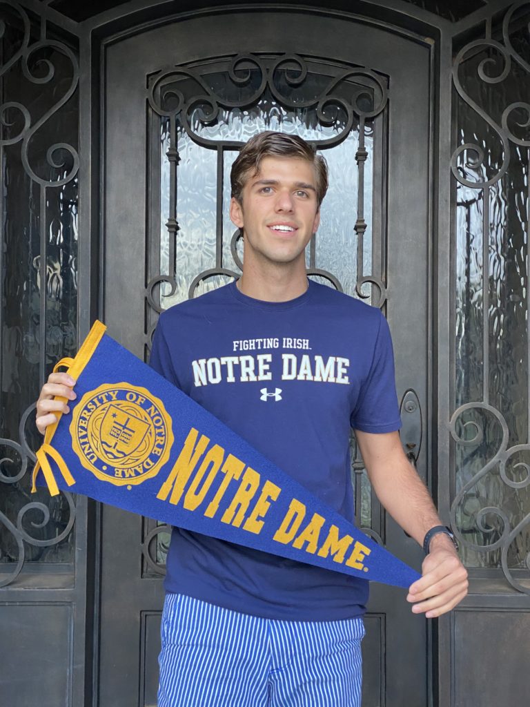 client success stories; collegeadvisor.com image: a photo of Sebastian Whitaker with Notre Dame pennant